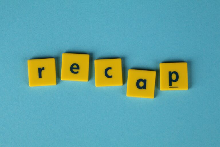 Yellow letter tiles spelling 'recap' against a blue backdrop, ideal for presentations.
